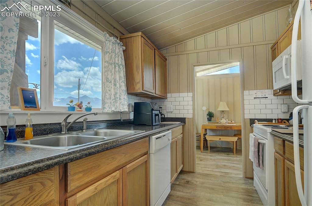 20 Main Street Silver Cliff, CO 81252 - Photo 10 of 28 a kitchen with stainless steel appliances granite countertop a sink stove and cabinets