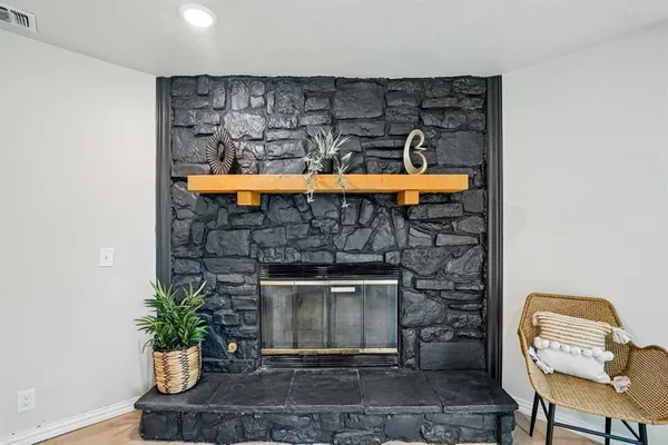 a room with furniture and a fireplace