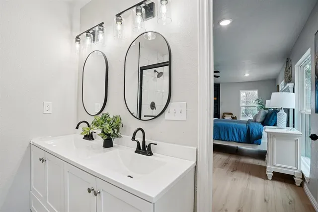 a bathroom with a sink and a mirror