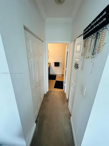 a view of a hallway view with wooden floor and staircase