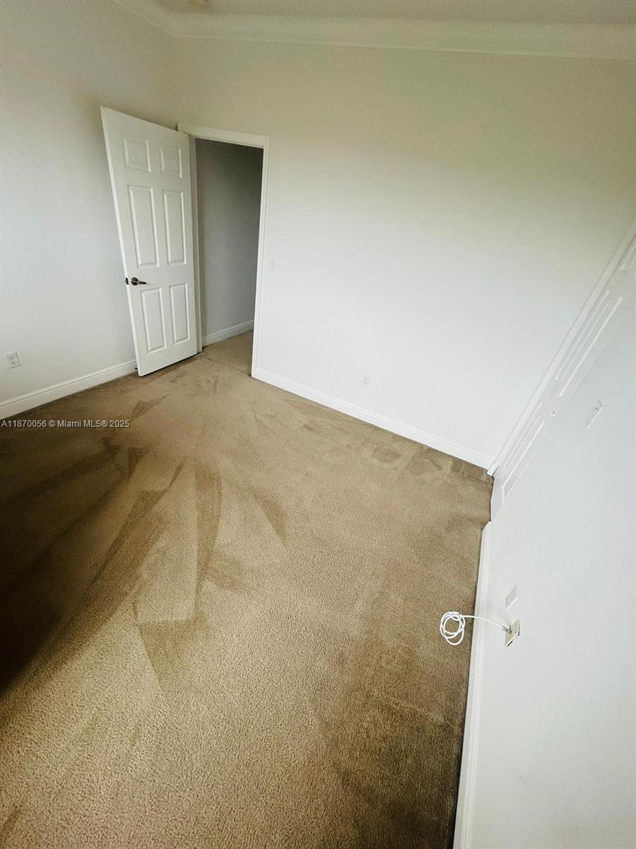 819 Southwest 147th Avenue, Unit 1405 Pembroke Pines, FL 33027 - Photo 20 of 31 an empty room with windows