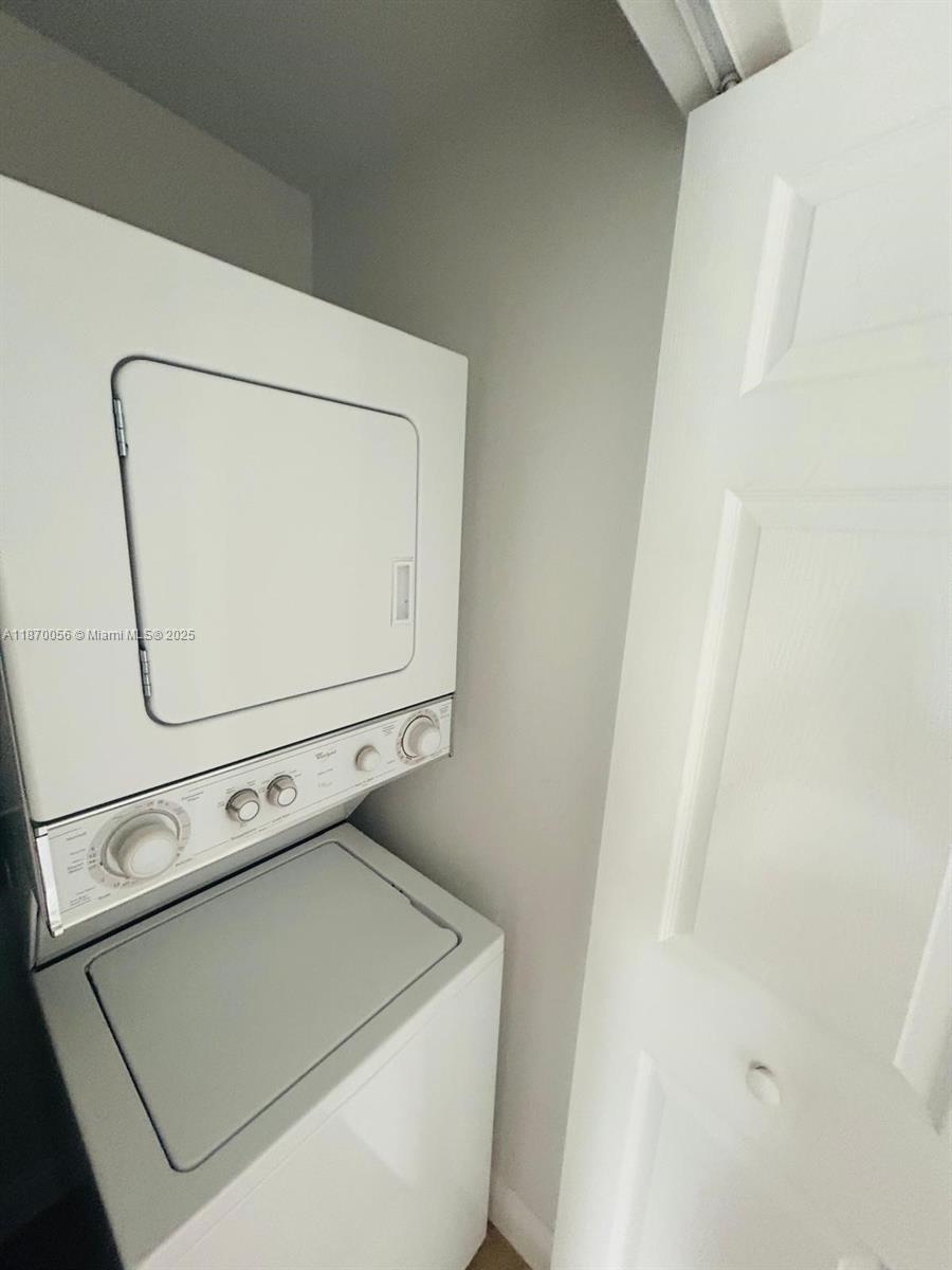 819 Southwest 147th Avenue, Unit 1405 Pembroke Pines, FL 33027 - Photo 22 of 31 a utility room with dryer and washer