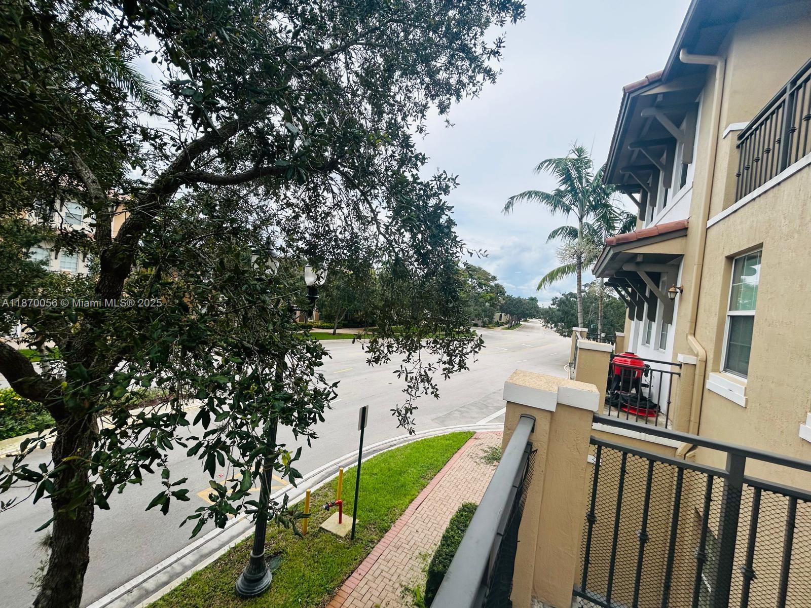 819 Southwest 147th Avenue, Unit 1405 Pembroke Pines, FL 33027 - Photo 28 of 31 a view of a house with backyard and sitting area