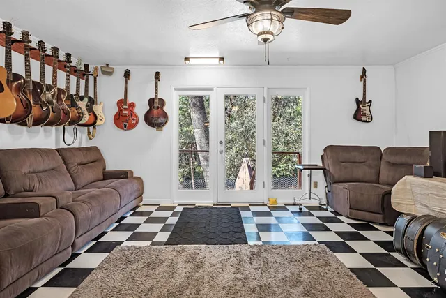 a bedroom with furniture and a rug