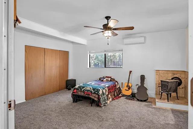 a bedroom with bed and a chandelier