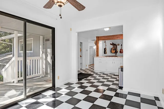 a view of a bedroom with a black and white checkered floor