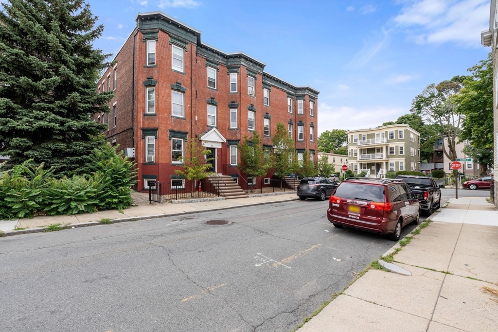 80-84 Shepton Street, Unit 803 Boston, MA 02124 - Photo 16 of 16 a car parked in front of a building