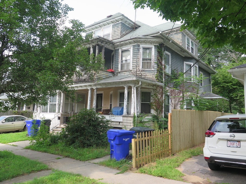 48 Eleanor Road Springfield, MA 01108 - Photo 1 of 23 a front view of a house with a garden and plants