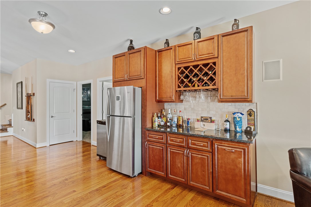 119 Turnberry Road Anderson, SC 29621 - Photo 33 of 50 This inviting space features a well-appointed wet bar with rich cabinetry and ample storage.