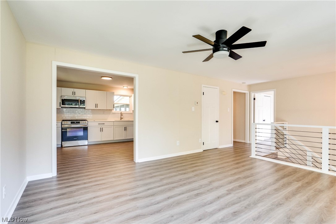 1173 Dussel Road Kent, OH 44240 - Photo 8 of 16 Living room featuring light hardwood flooring and ceiling fan