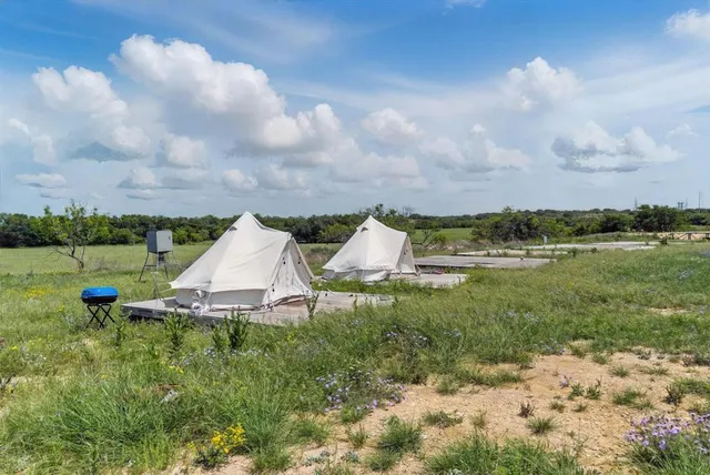 a view of a garden with an outdoor seating