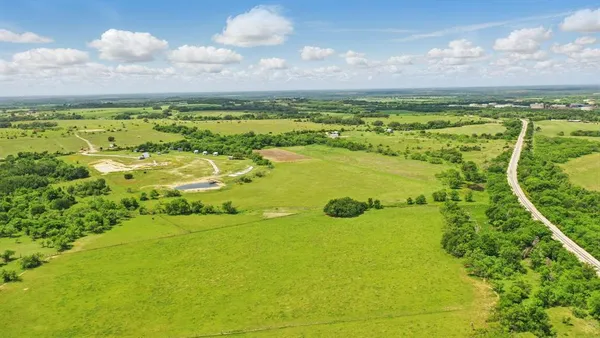 a view of a lake with a big yard