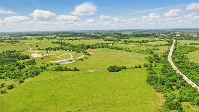 a view of a lake with a big yard