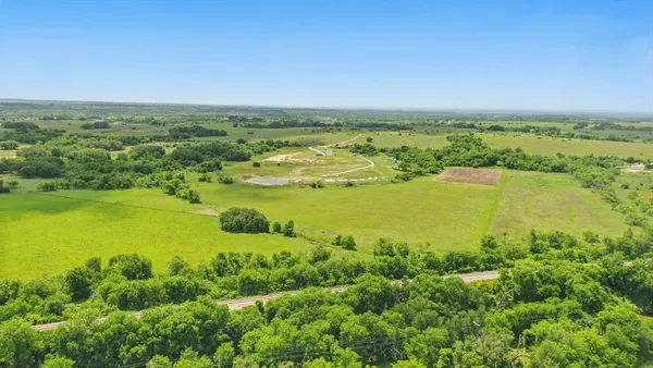 a view of a lake with a big yard