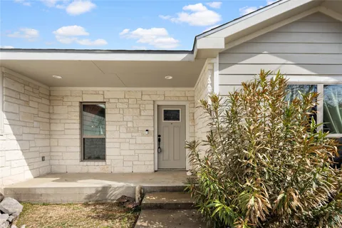 a kitchen view with appliances and cabinets