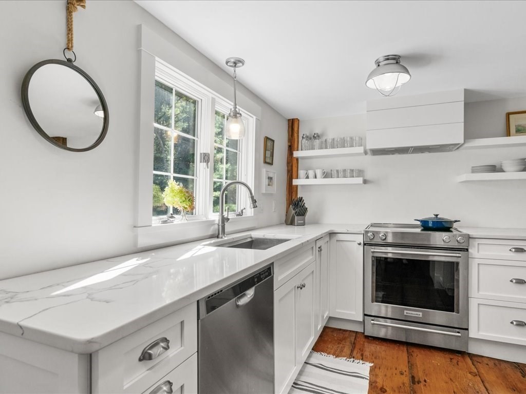 144 Old County Road Sandwich, MA 02537 - Photo 11 of 42 a kitchen with a sink cabinets and stainless steel appliances