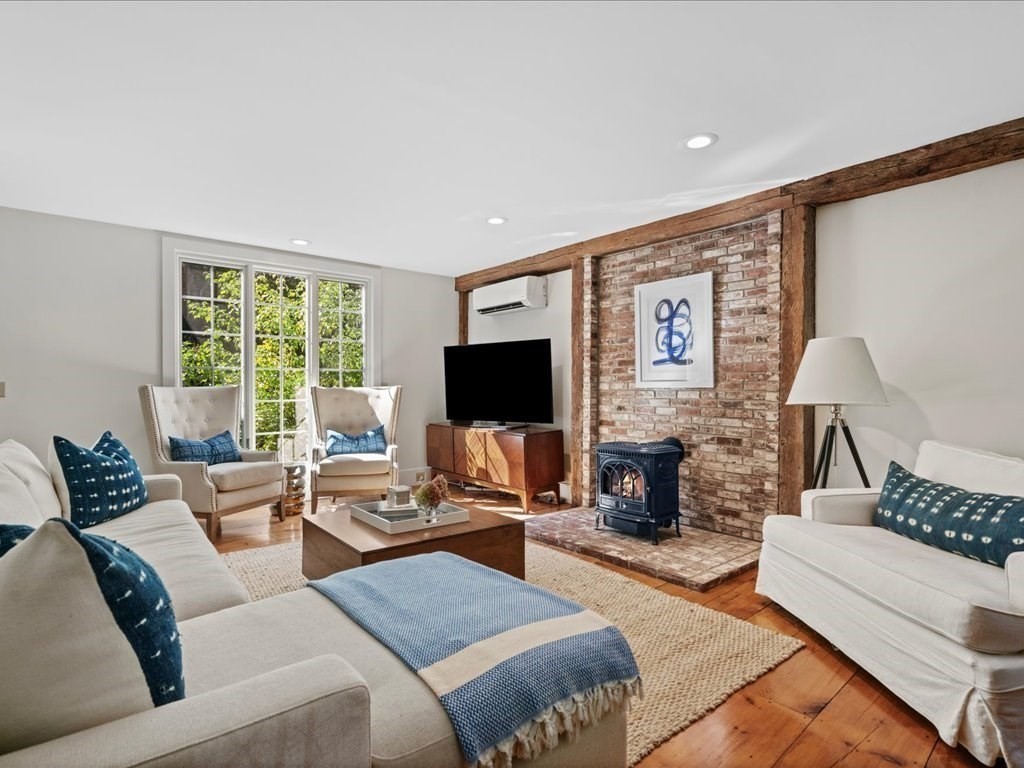 144 Old County Road Sandwich, MA 02537 - Photo 13 of 42 a living room with furniture fireplace and flat screen tv