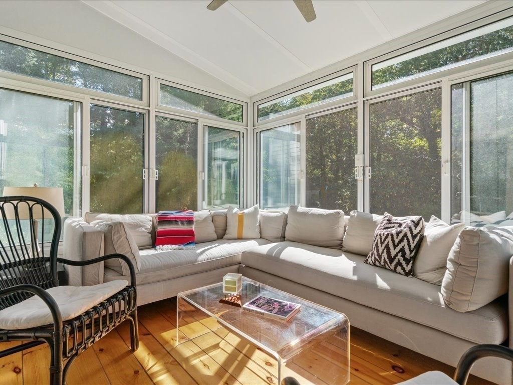 144 Old County Road Sandwich, MA 02537 - Photo 16 of 42 a living room with furniture and a large window
