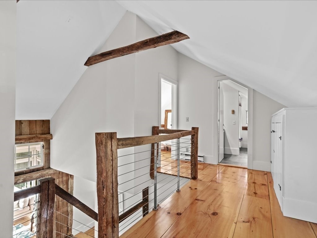 144 Old County Road Sandwich, MA 02537 - Photo 22 of 42 a view of a hallway with wooden floor and staircase