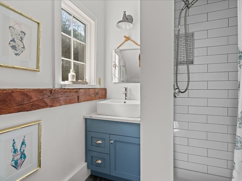 144 Old County Road Sandwich, MA 02537 - Photo 29 of 42 a bathroom with a sink and a mirror