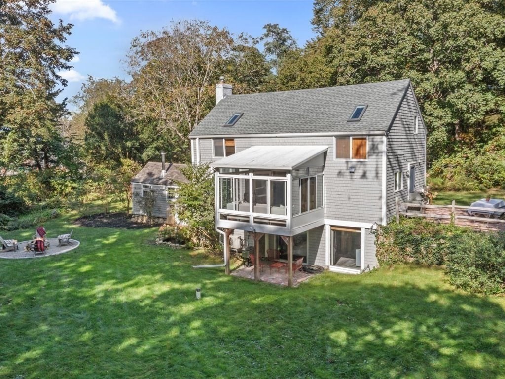 144 Old County Road Sandwich, MA 02537 - Photo 35 of 42 an aerial view of a house with a yard table and chairs