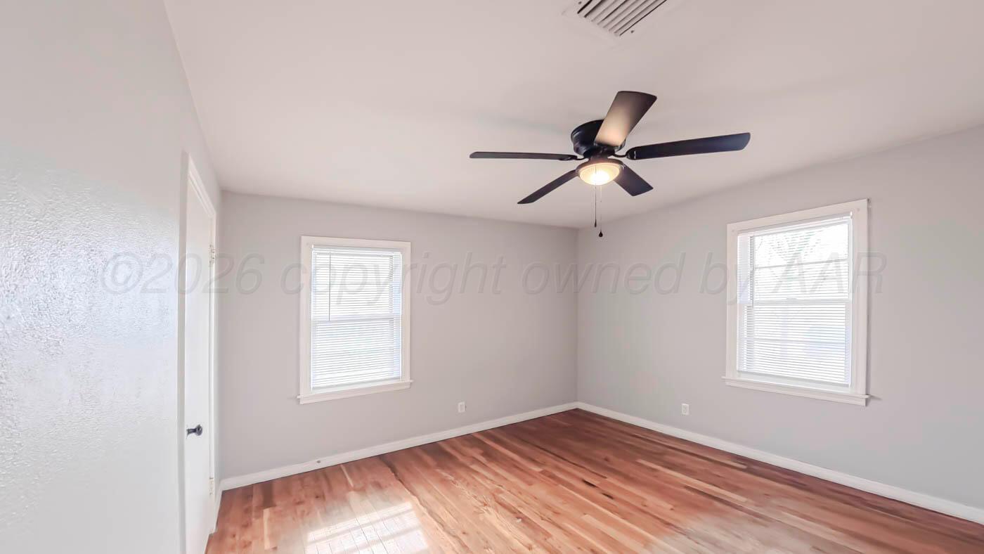 300 North Bryan Street Borger, TX 79007 - Photo 11 of 21 a view of room with a ceiling fan and window