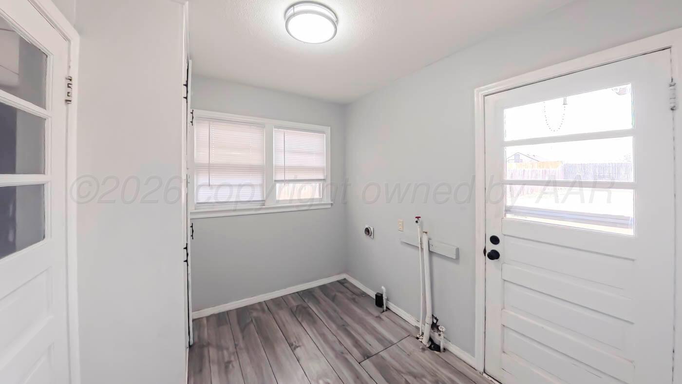 300 North Bryan Street Borger, TX 79007 - Photo 17 of 21 a view of a bathroom with wooden floor and a window