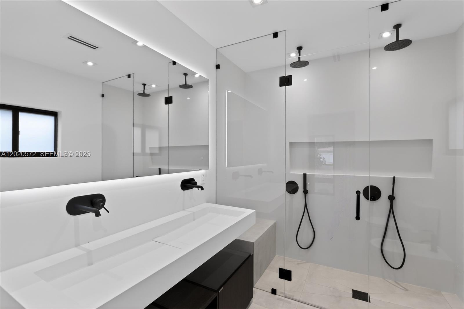 439 Hardee Road Coral Gables, FL 33146 - Photo 22 of 35 a bathroom with a tub sink and mirror