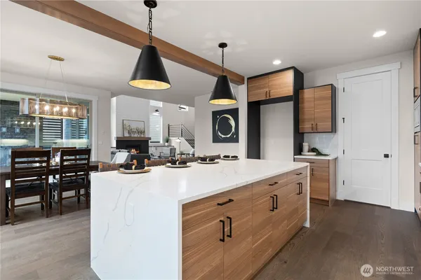 a kitchen with sink stove and cabinets