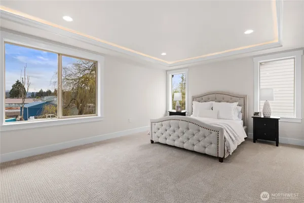 a bedroom with a bed lamp and window