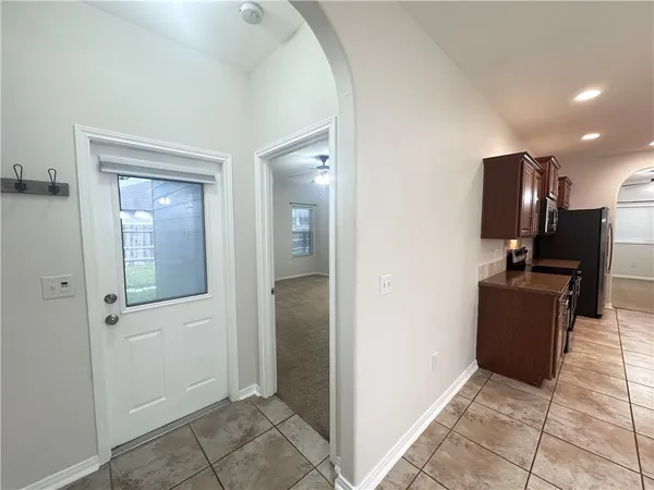 workspace with wooden floor cabinet and windows