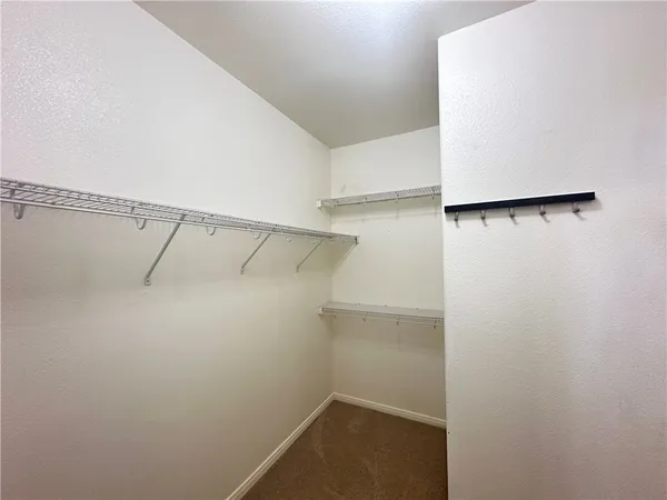 a view of an empty walk in closet