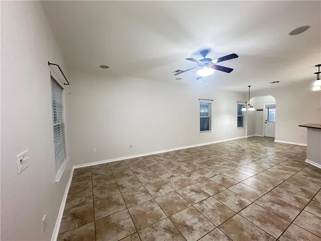 a view of a kitchen with a sink and a chandelier fan