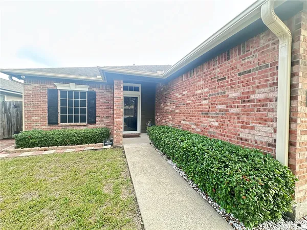 a view of house with backyard