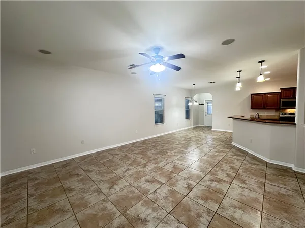 a view of a kitchen with a sink and a chandelier