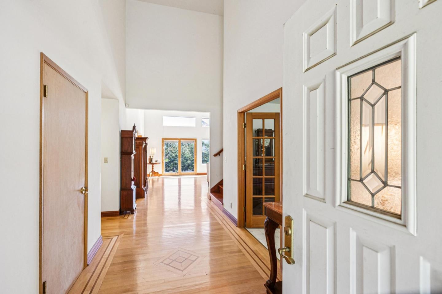 24595 Skyland Road Los Gatos, CA 95033 - Photo 16 of 68 a view of a hallway with wooden floor and windows