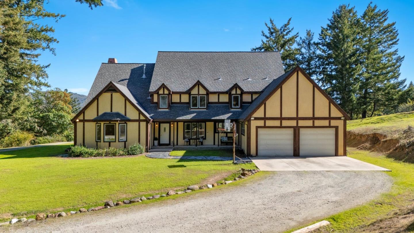 24595 Skyland Road Los Gatos, CA 95033 - Photo 2 of 68 a front view of house with yard and green space