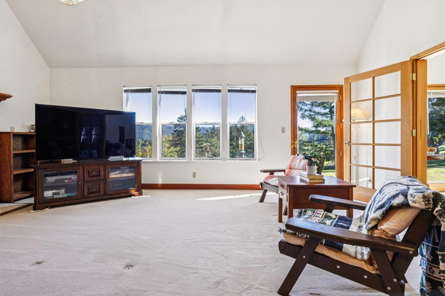 24595 Skyland Road Los Gatos, CA 95033 - Photo 25 of 68 a living room with furniture and a flat screen tv