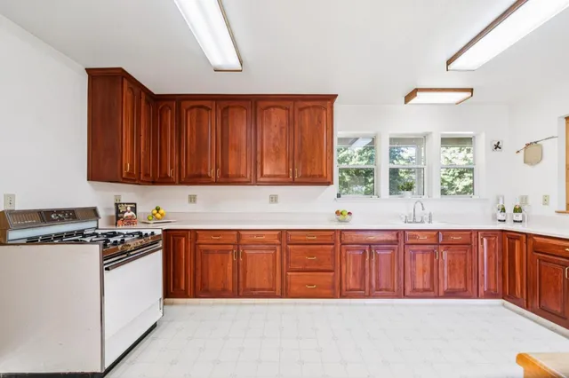 a room with a bed and a mirror