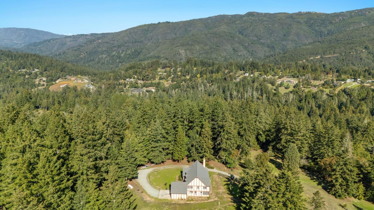 24595 Skyland Road Los Gatos, CA 95033 - Photo 6 of 68 a view of a lush green field with a mountain in the background