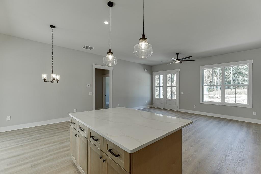 125 Rains Road Jefferson, GA 30549 - Photo 13 of 43 a view of a kitchen and an empty room