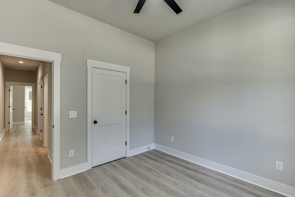 125 Rains Road Jefferson, GA 30549 - Photo 19 of 43 wooden floor in an empty room