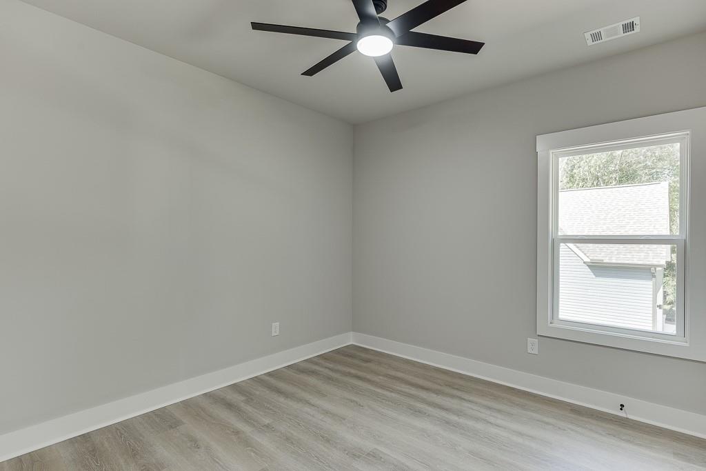 125 Rains Road Jefferson, GA 30549 - Photo 21 of 43 an empty room with a window and a fan