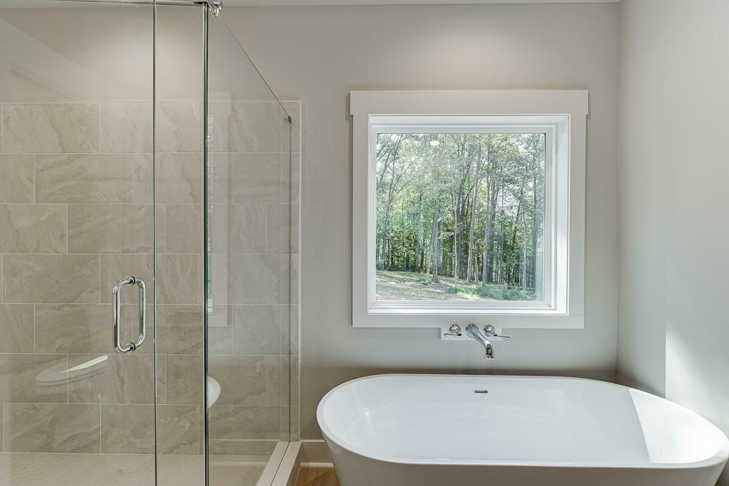 125 Rains Road Jefferson, GA 30549 - Photo 33 of 43 a bathroom with a tub and shower