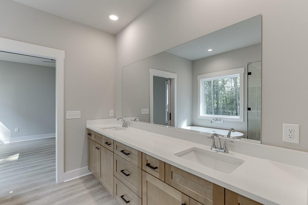 125 Rains Road Jefferson, GA 30549 - Photo 34 of 43 a bathroom with a sink and a mirror