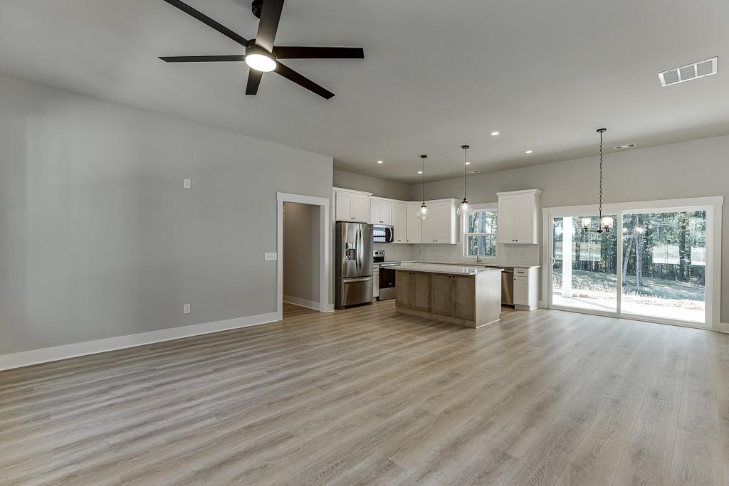125 Rains Road Jefferson, GA 30549 - Photo 5 of 43 a view of kitchen with microwave and refrigerator