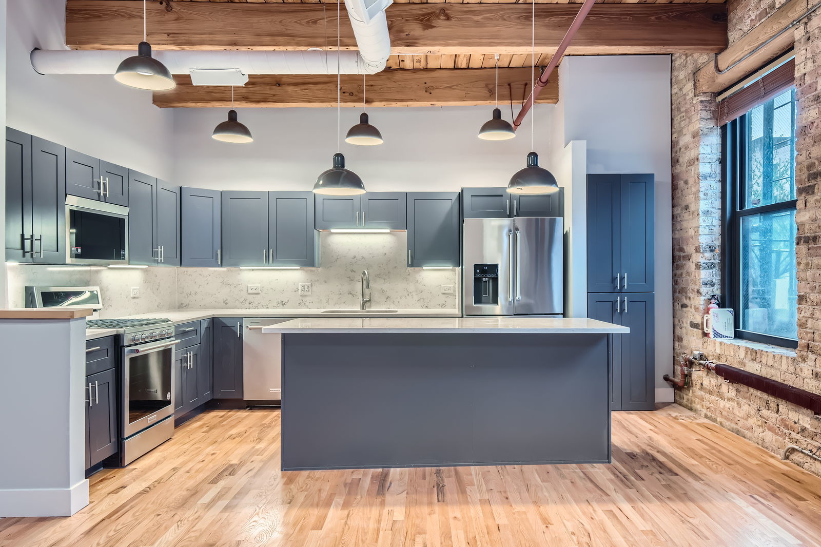368 West Huron Street, Unit 2N Chicago, IL 60654 - Photo 14 of 28 a kitchen with stainless steel appliances granite countertop a sink stove and refrigerator