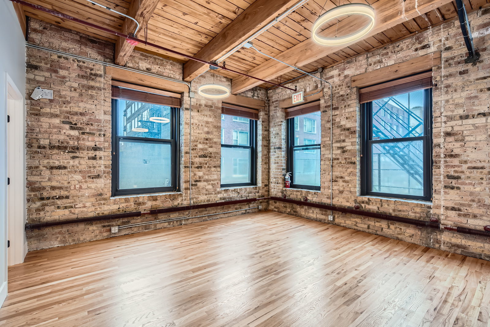 368 West Huron Street, Unit 2N Chicago, IL 60654 - Photo 15 of 28 an empty room with wooden floor and windows