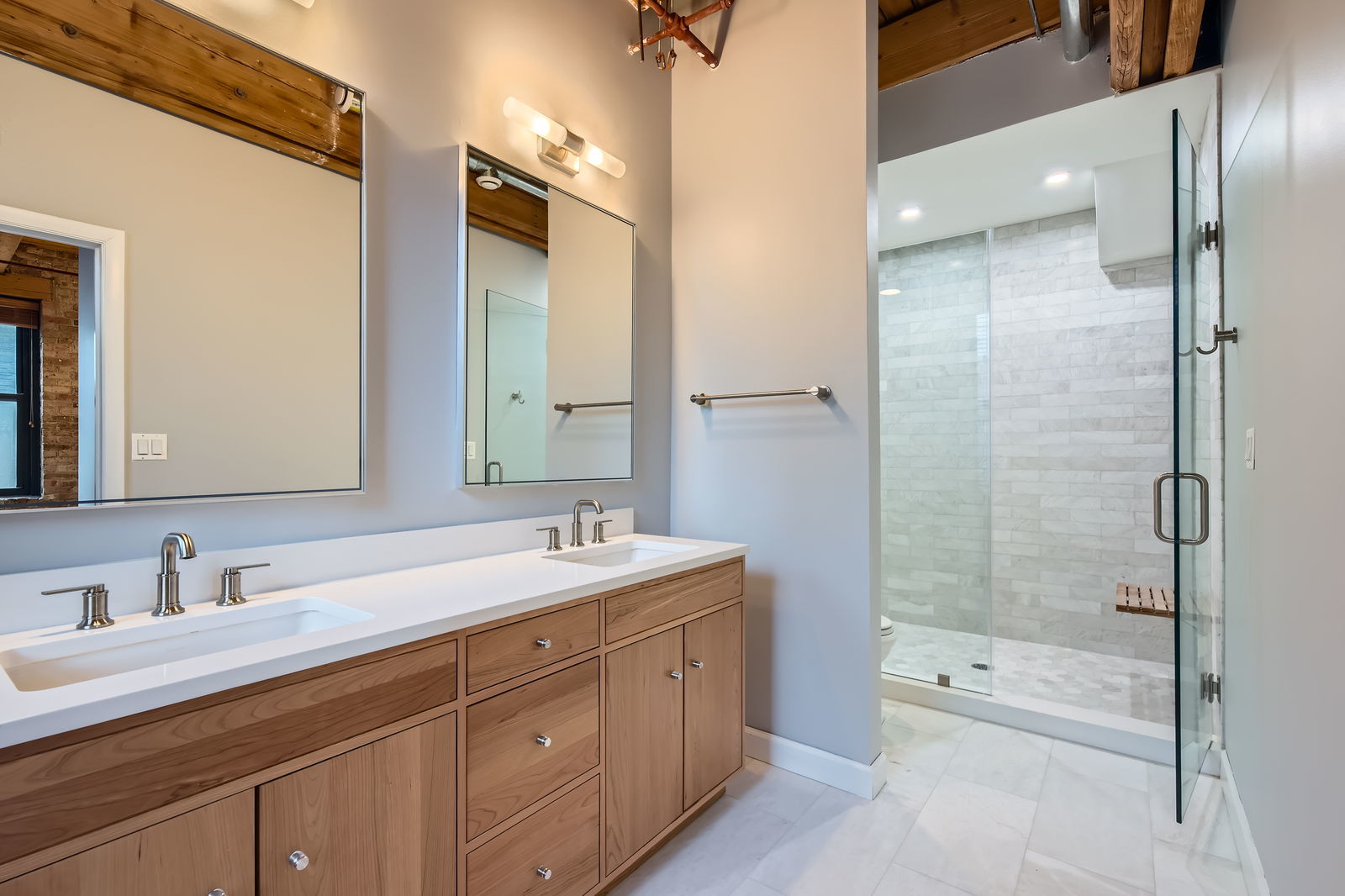 368 West Huron Street, Unit 2N Chicago, IL 60654 - Photo 19 of 28 a bathroom with a shower tub double vanity sink and mirror