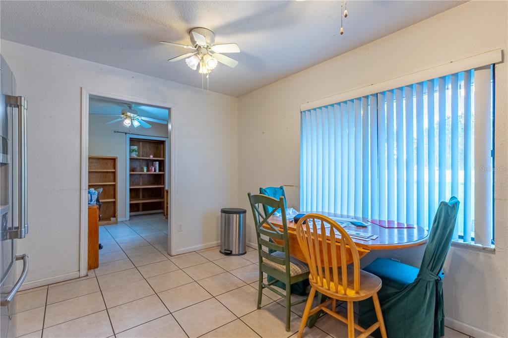 9349 Edison Road Lithia, FL 33547 - Photo 14 of 27 a view of a dining room with furniture and chandelier